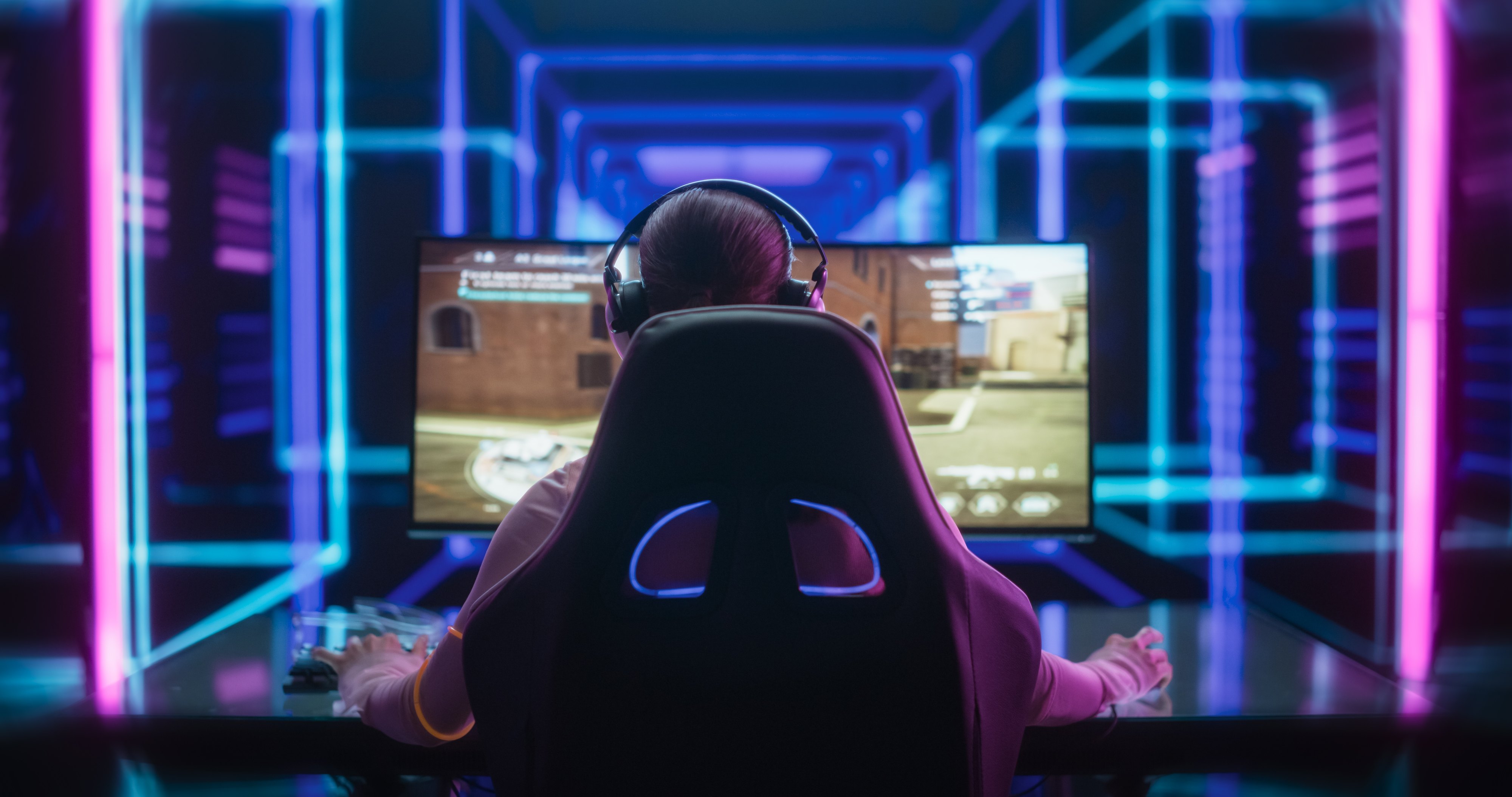 Young Female Professional Gamer Competing in an E-Sports Championship Event in a Futuristic Neon Arena